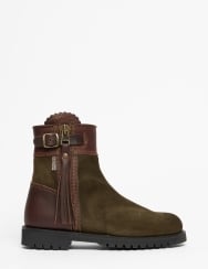 Green suede ankle boot with brown accents on a white background