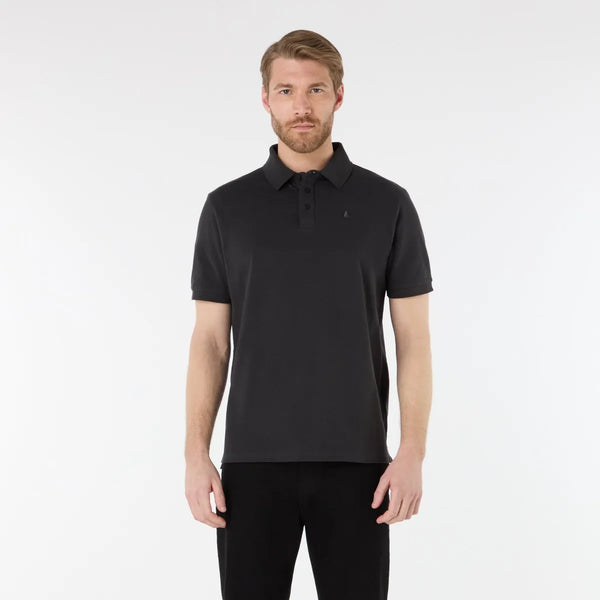 Man wearing a black polo shirt on a white background