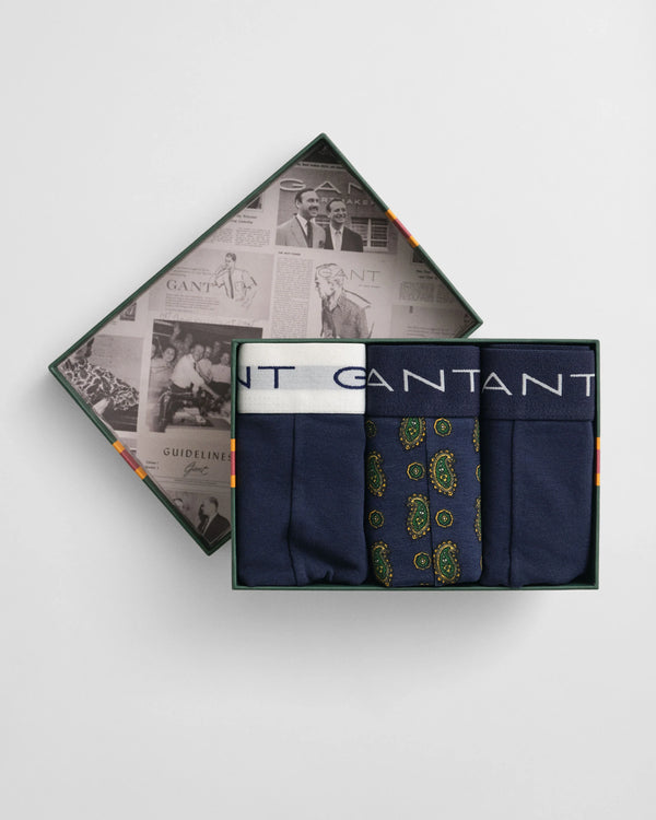 Boxer briefs with a patterned design in a branded box on a light gray background