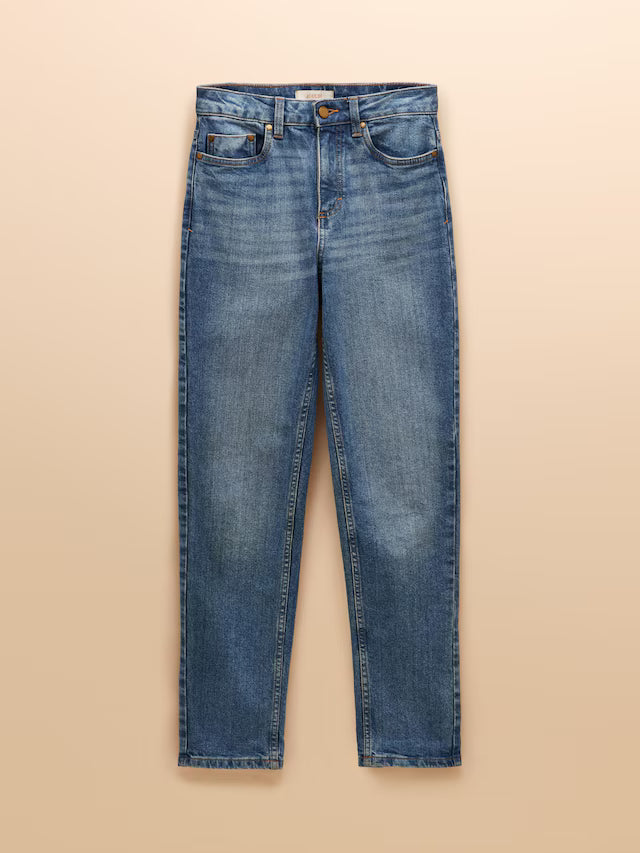 Blue jeans on a beige background