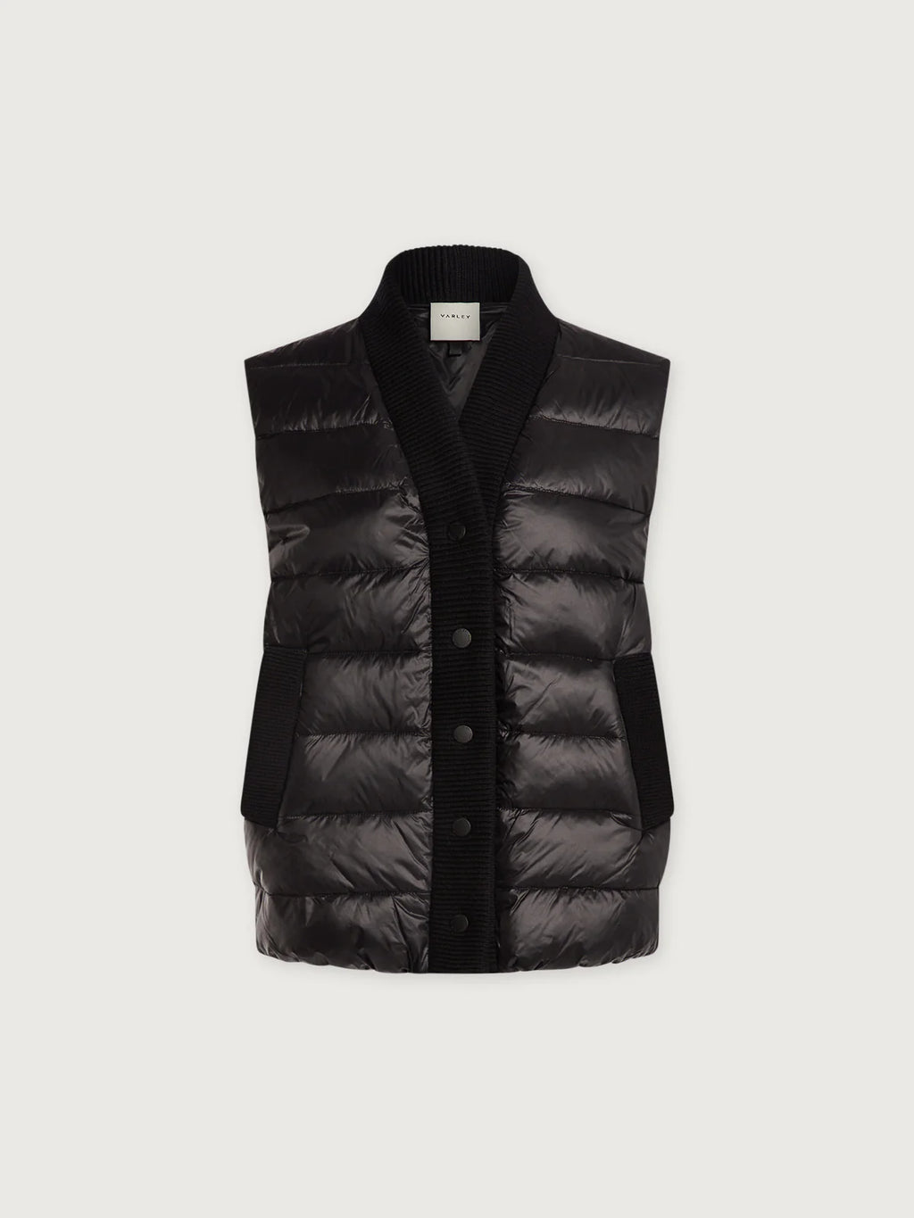 Black puffer vest on a light gray background