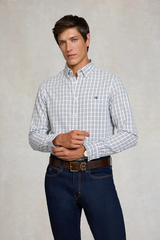 Man wearing a checkered shirt and jeans against a plain background
