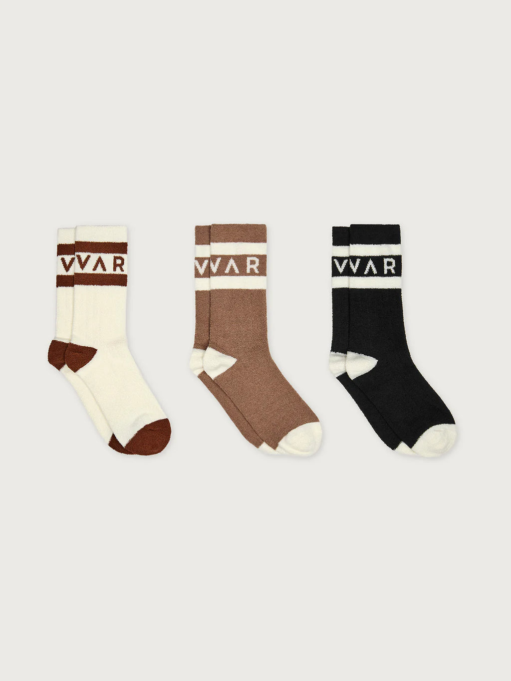 Three pairs of socks in white, brown, and black with a visible brand logo on a light gray background.