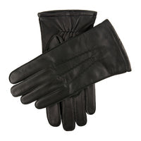 Pair of black leather gloves on a plain background
