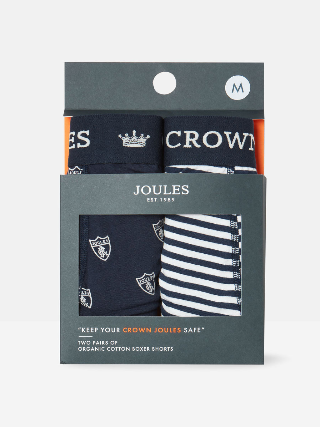 Packaging of Crown Joules organic cotton boxer shorts with navy and striped designs.