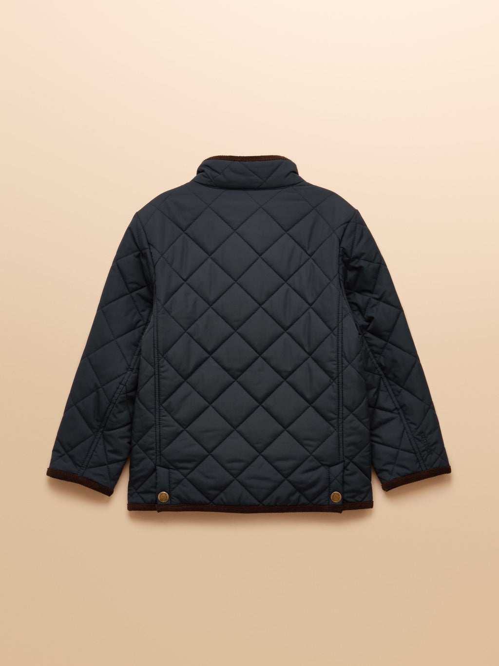 Black quilted jacket on a beige background
