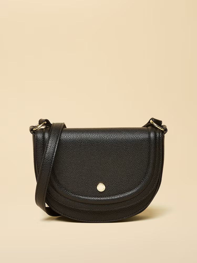 Black handbag on a yellow background