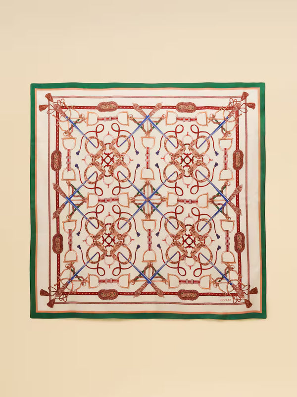 Decorative scarf with intricate patterns on a beige background