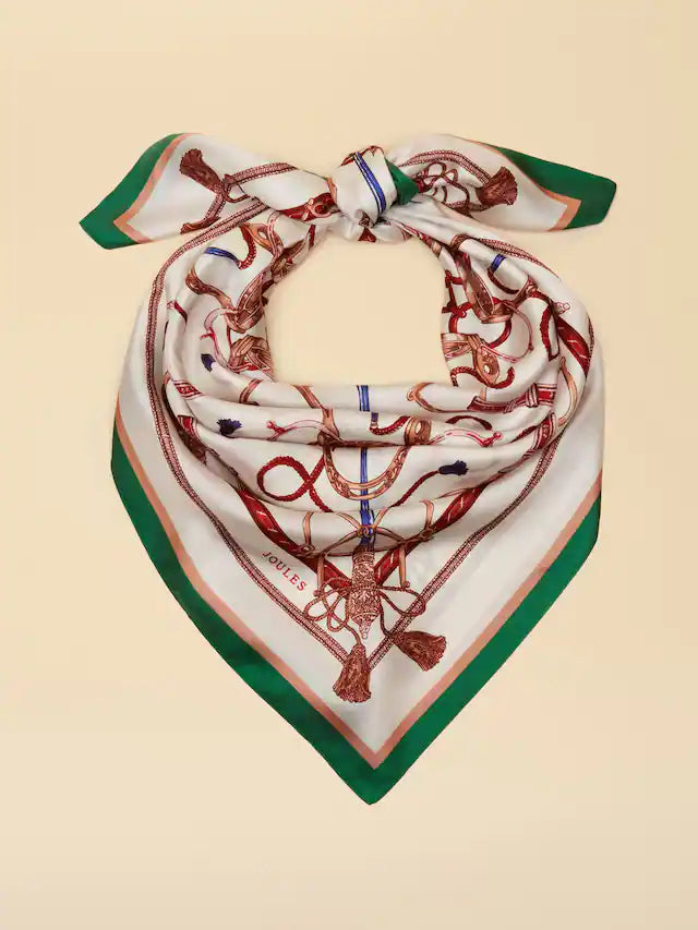 Decorative scarf with intricate patterns on a beige background