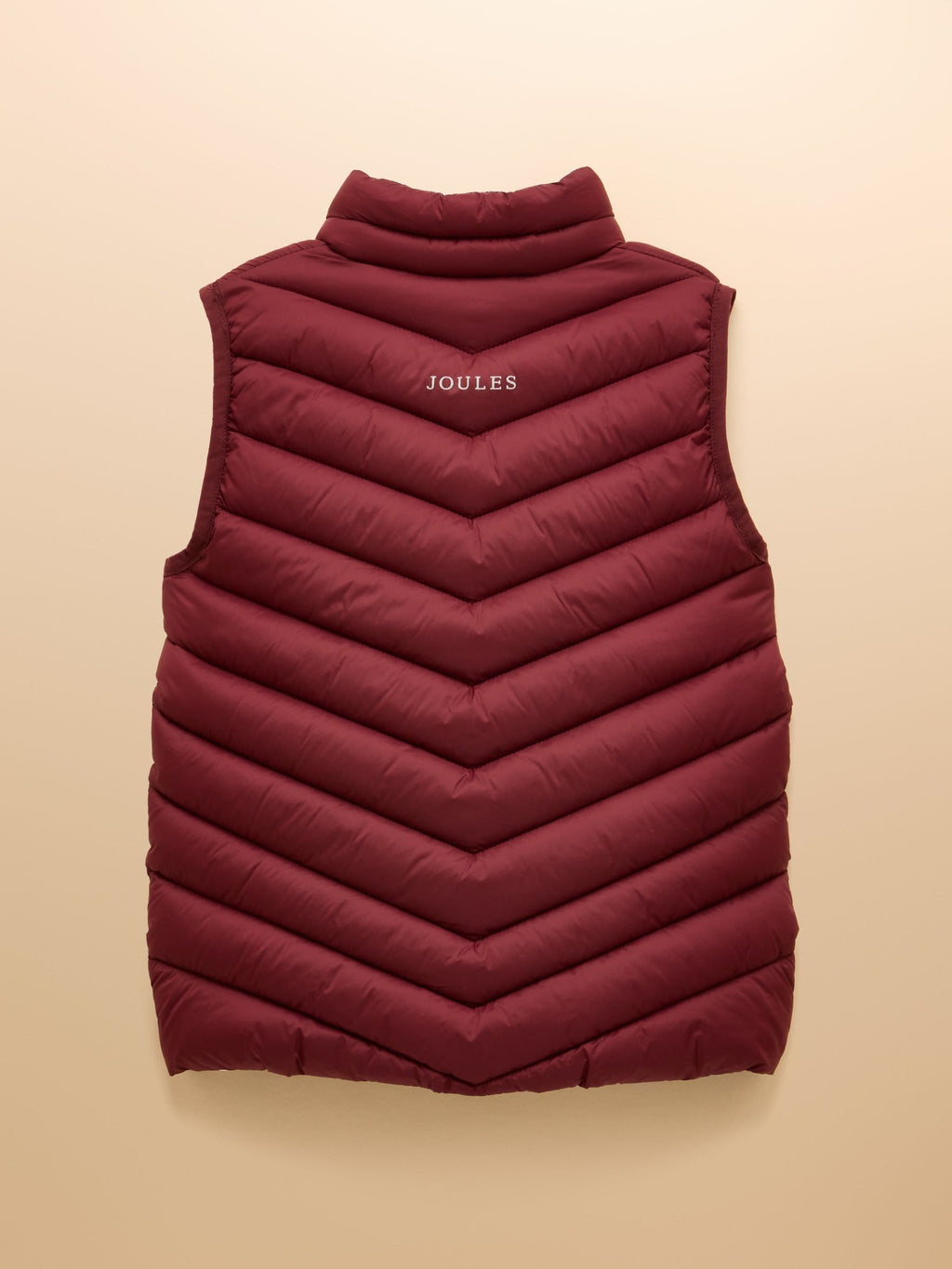 Maroon puffer vest with 'Joules' branding on a beige background