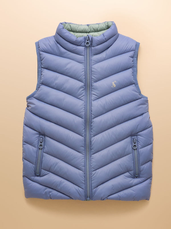 Blue puffer vest on a beige background