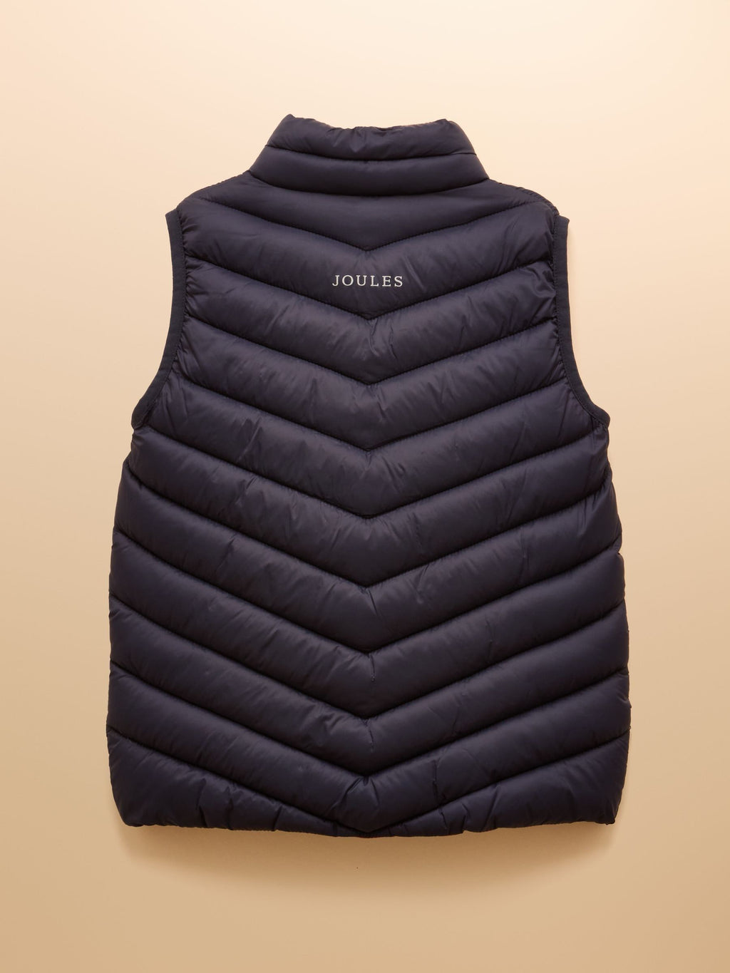 Black puffer vest with 'Joules' branding on a beige background
