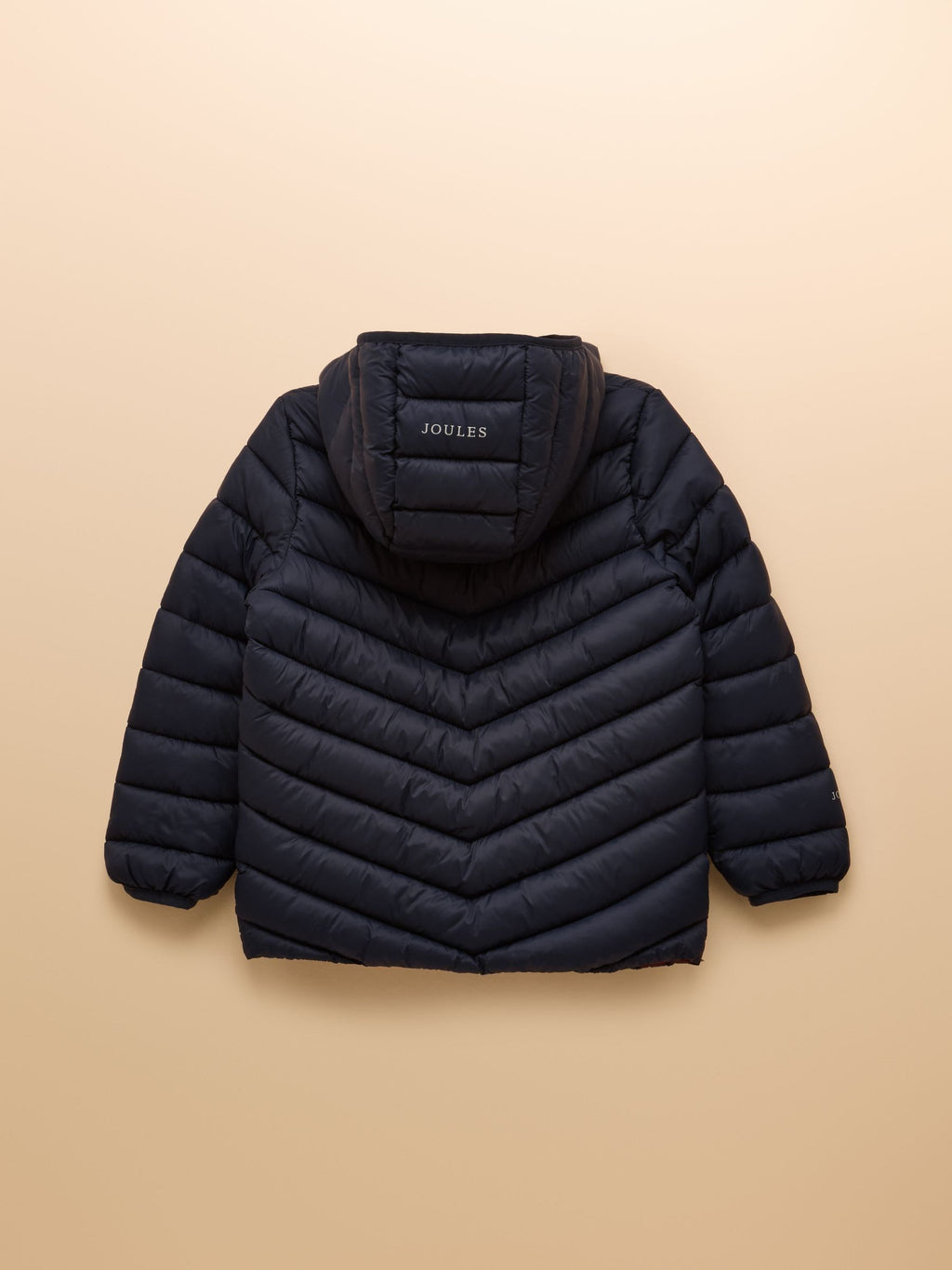 Black puffer jacket with a hood on a beige background