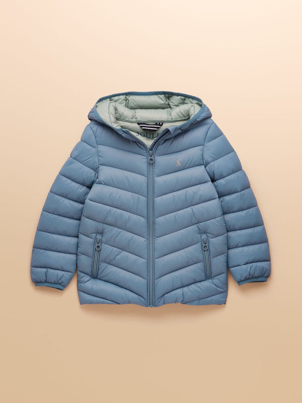 Blue puffer jacket on a beige background
