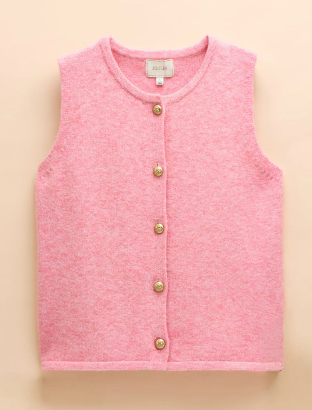Pink vest with gold buttons on a beige background