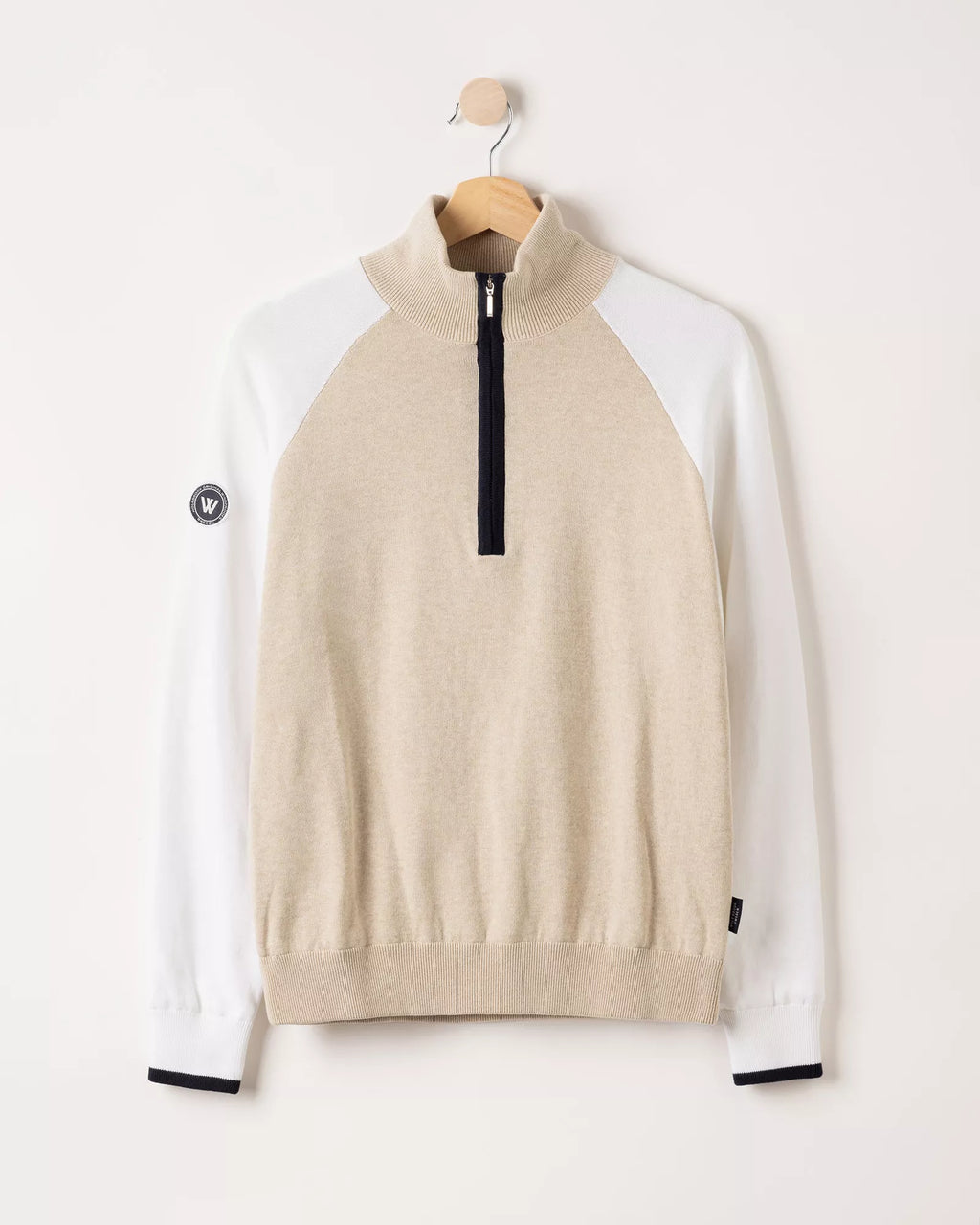 A beige and white pullover on a white background