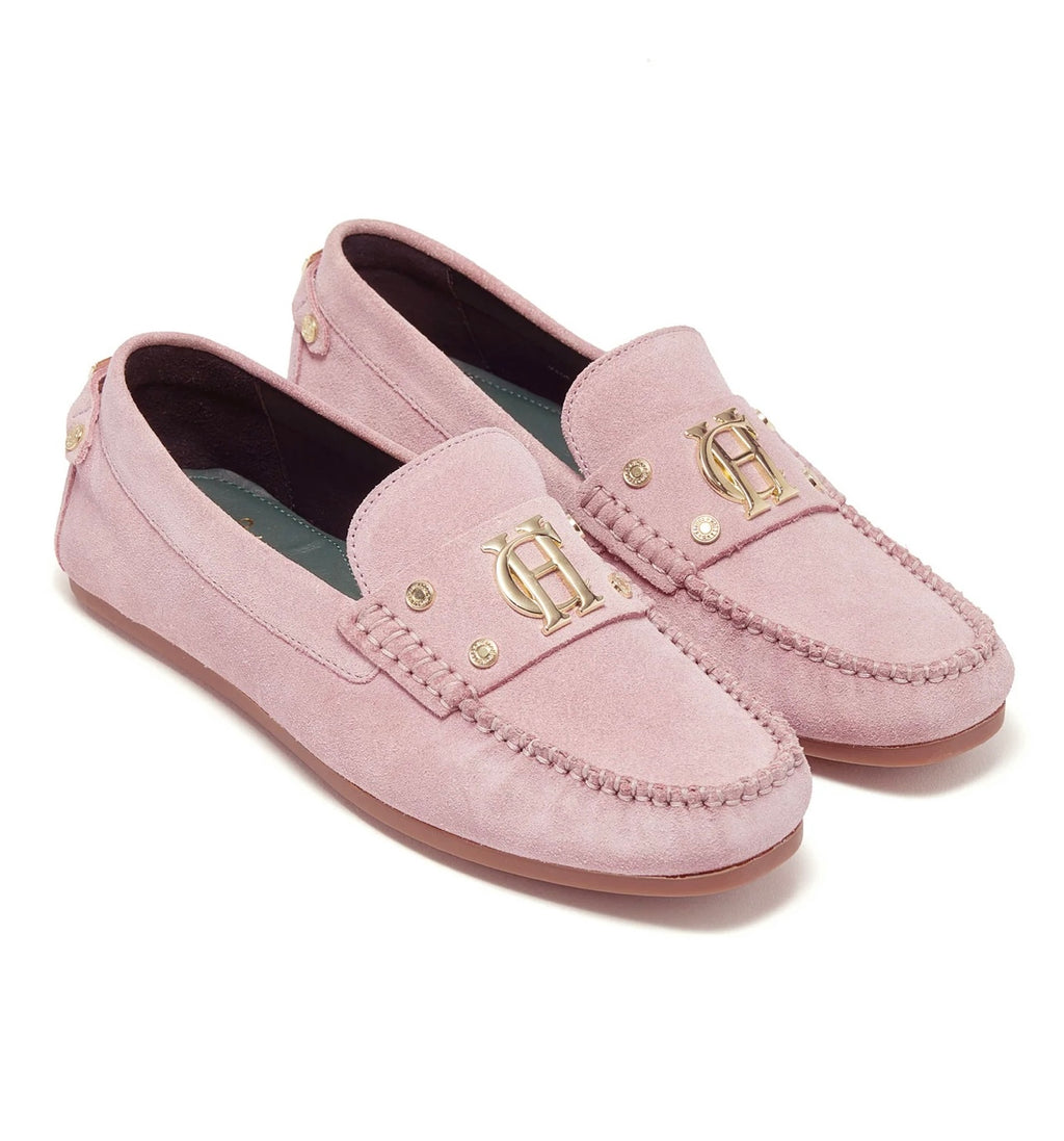 Pair of pink loafers with a brand logo on a white background