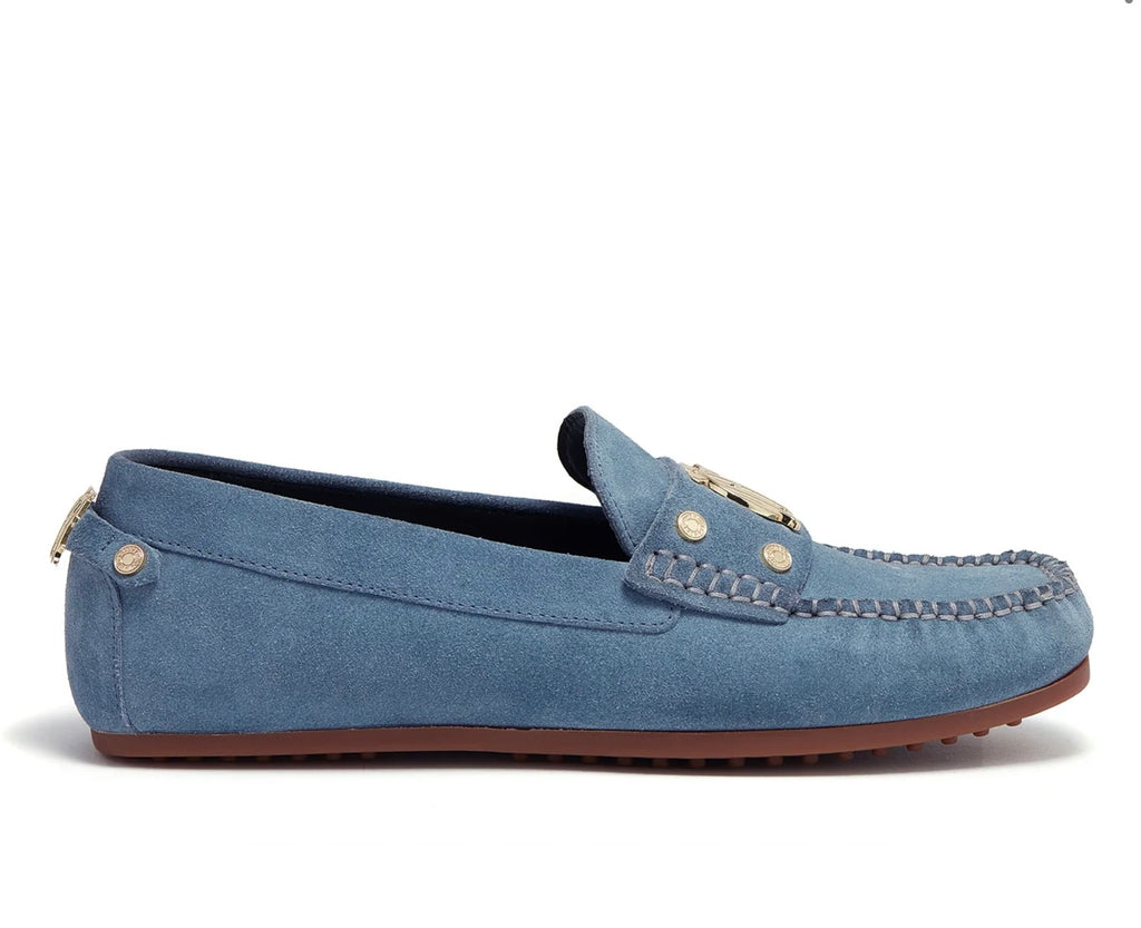 Blue suede loafer with brown sole on a white background