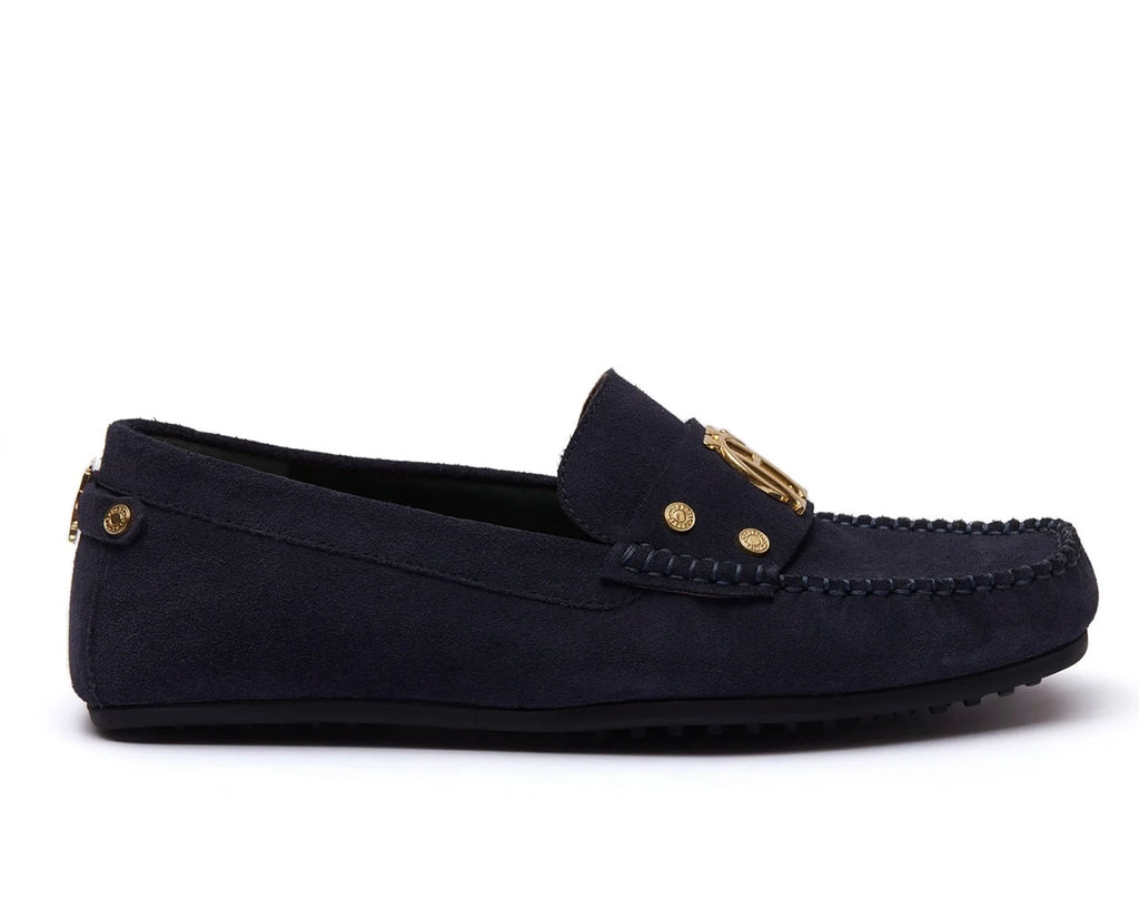 Navy blue loafer with gold accents on a white background