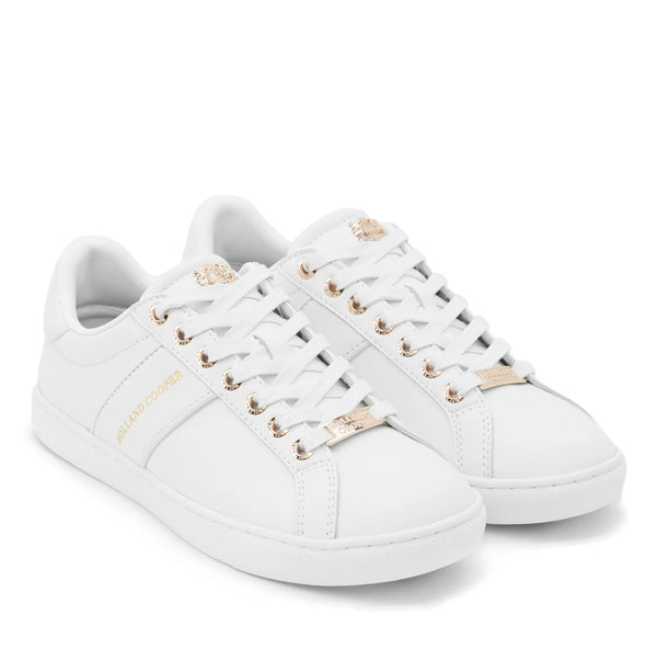 White sneakers with gold accents on a white background