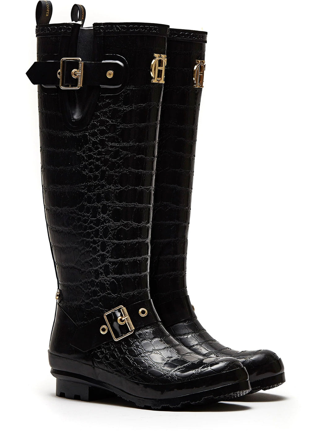 Black crocodile-patterned rain boots with gold buckles on a white background