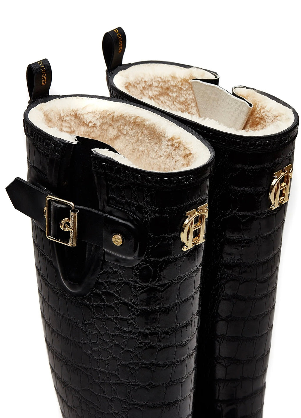 Black crocodile-patterned boots with gold buckles on a white background