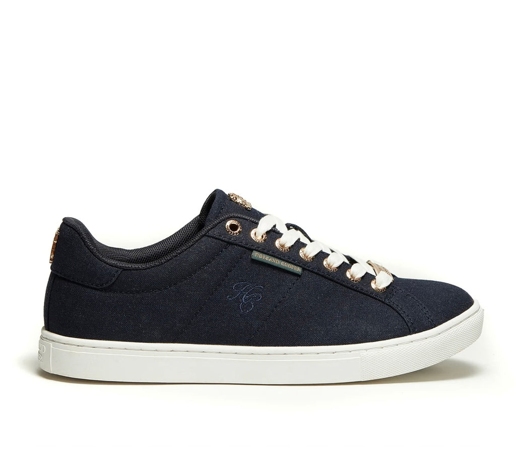 Navy blue sneaker with white laces on a white background