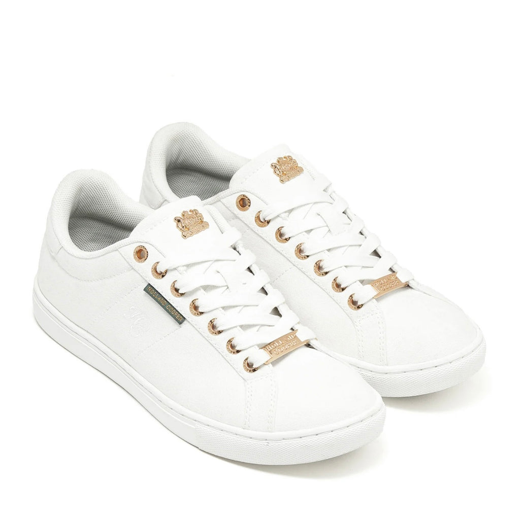 White sneakers with gold accents on a white background