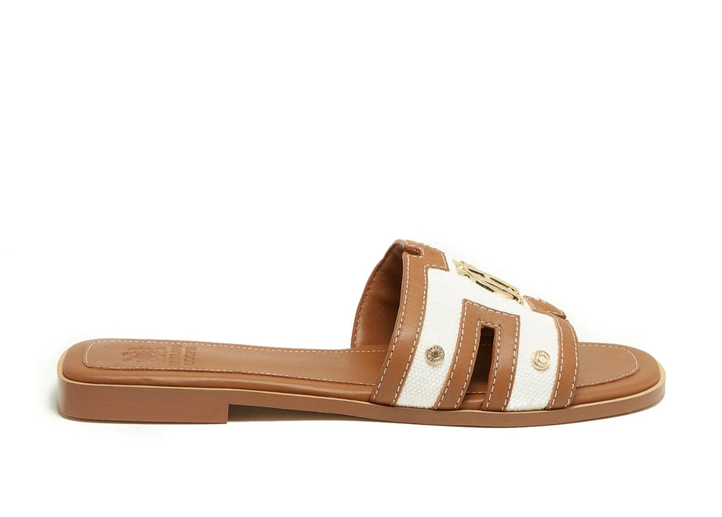 Brown and white sandal on a white background