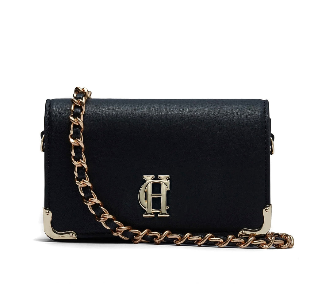 Black handbag with gold chain and logo on a white background