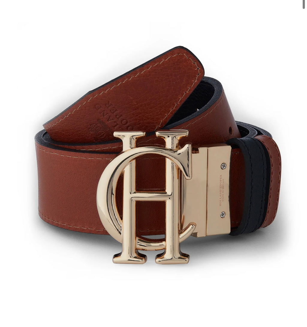 Brown leather belt with gold buckle on a white background