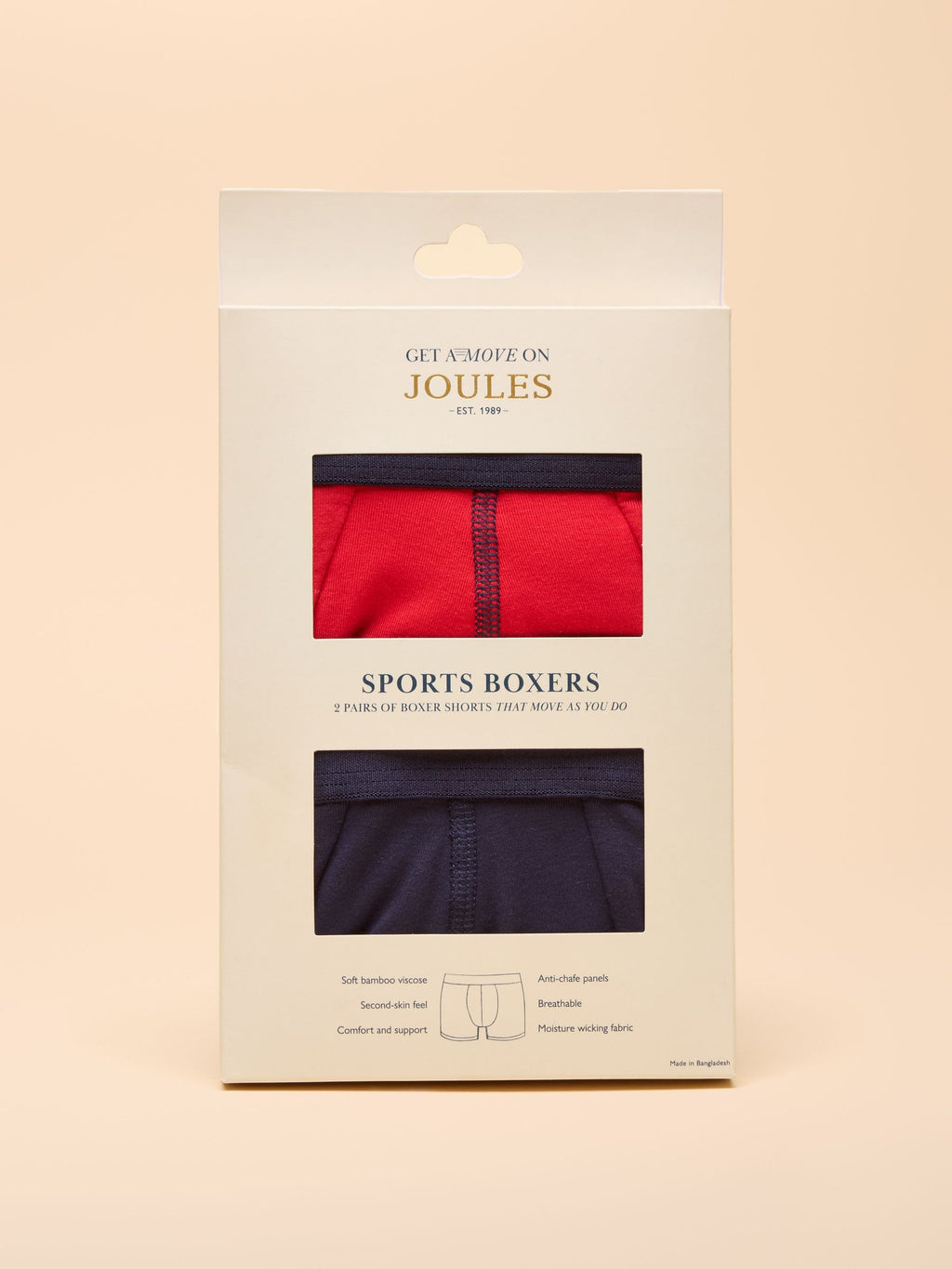 Packaging of Joules sports boxers with red and navy options on a beige background