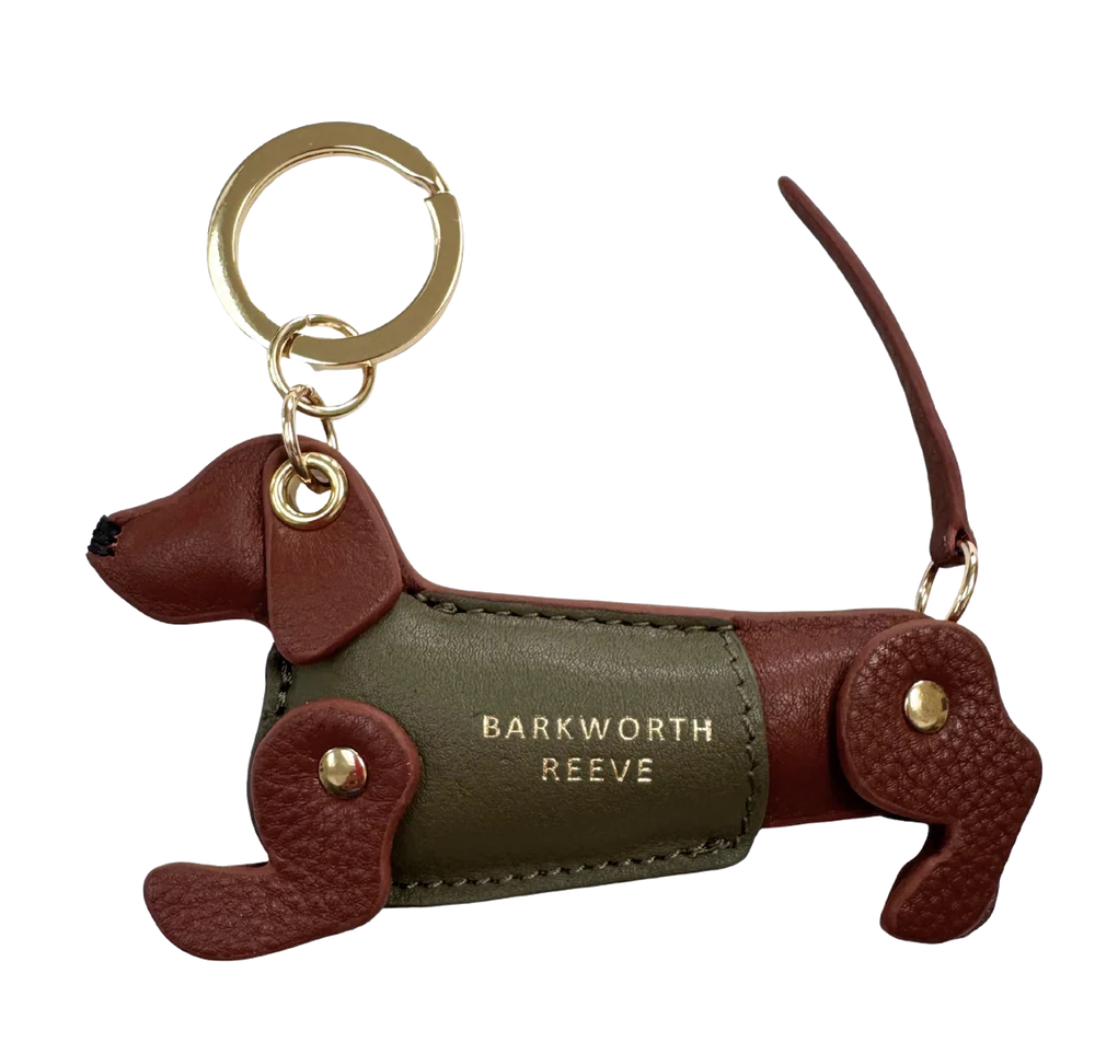 Dog-shaped keychain with 'Barkworth Reeve' branding on a white background