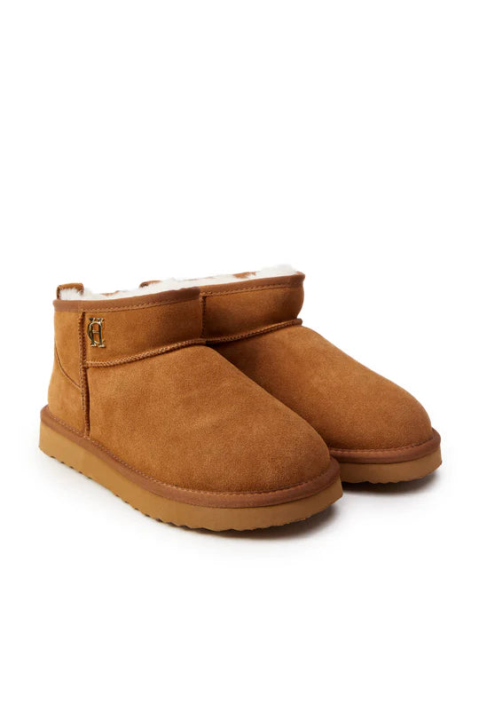 Pair of brown suede boots on a white background