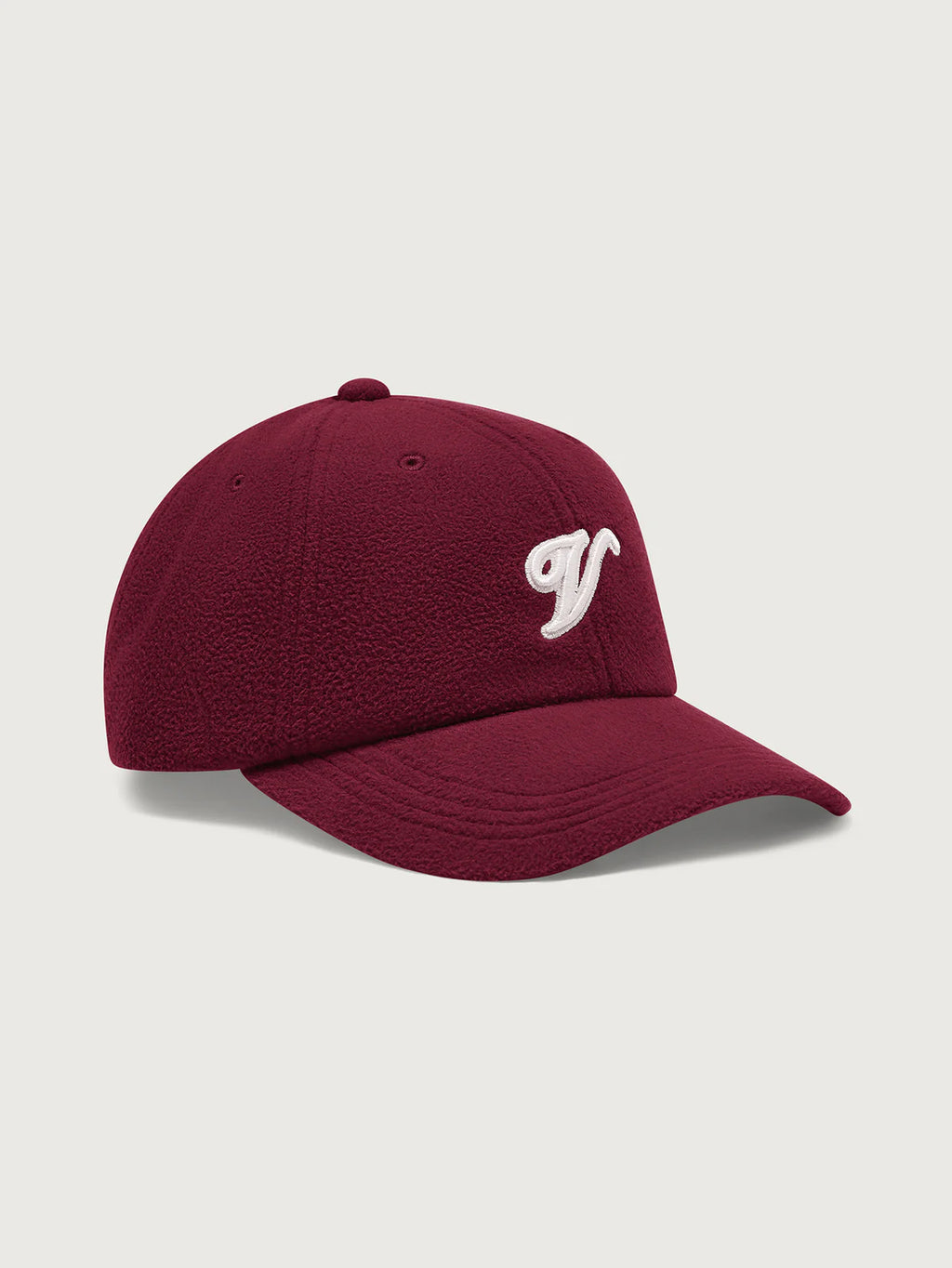 Maroon baseball cap with a white logo on a light gray background