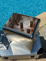 Metal bracket with bolts on a concrete surface near water