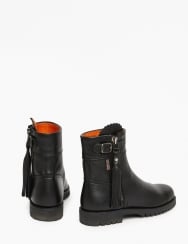 Pair of black leather boots with orange interior on a white background