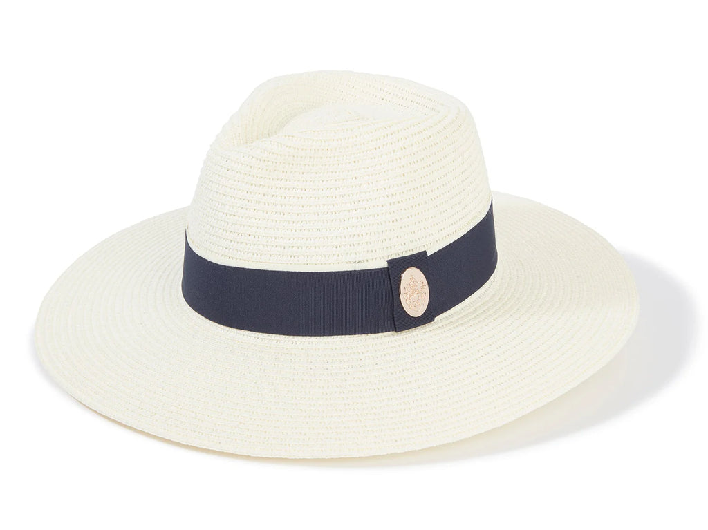 White straw hat with a navy band on a white background