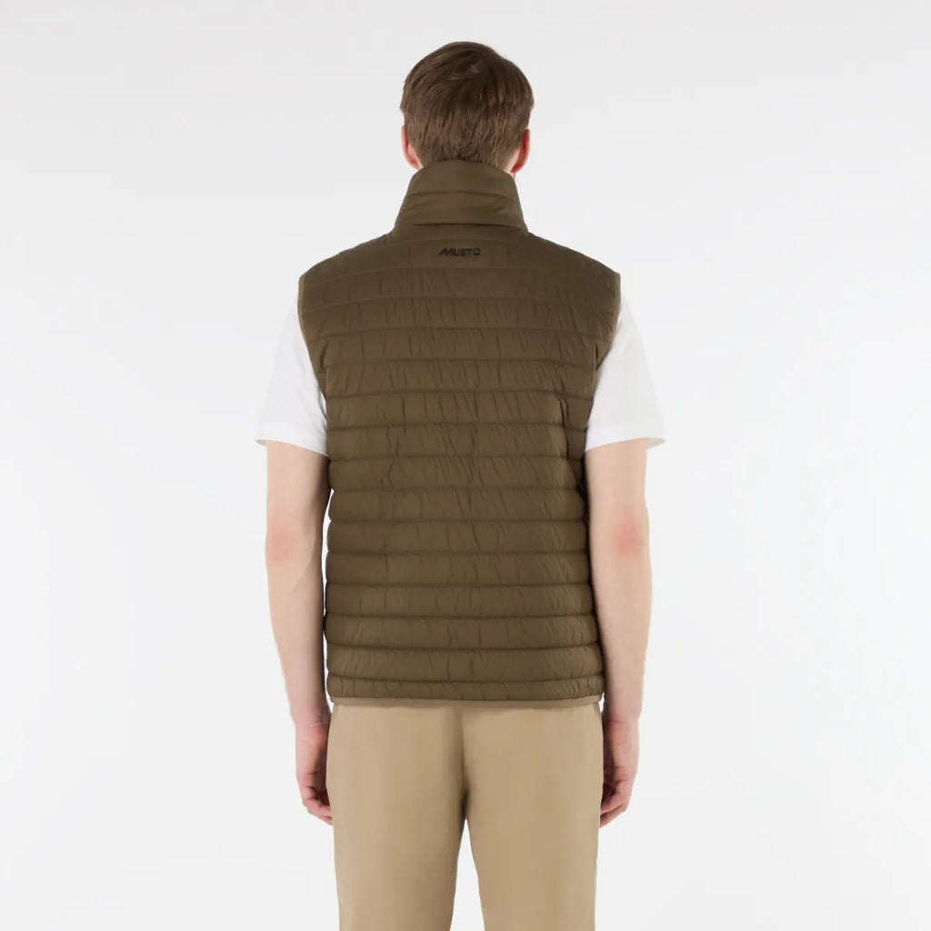 Man wearing a green vest on a white background