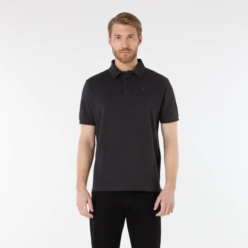 Man wearing a black polo shirt on a white background