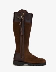 Brown knee-high boot with decorative buckle and tassel on a white background