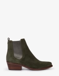 Green suede ankle boot with brown sole on a white background