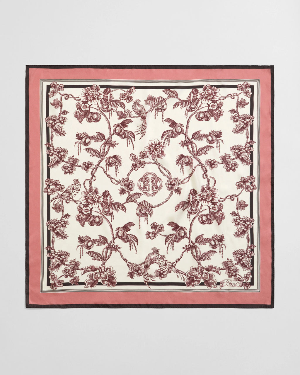 Floral patterned scarf with pink border on a light gray background
