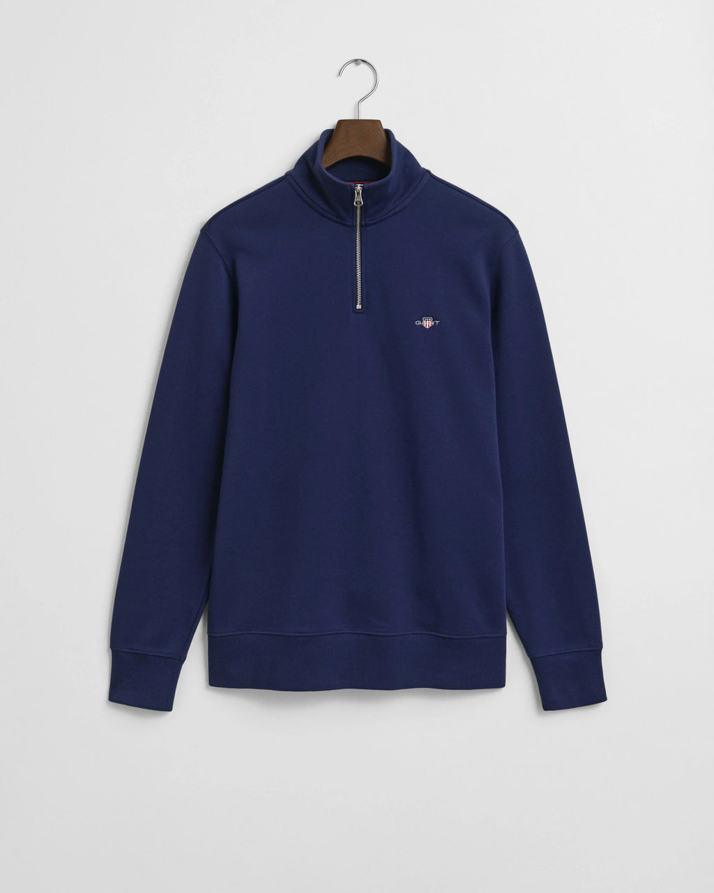 Navy blue sweatshirt with a small logo on a white background