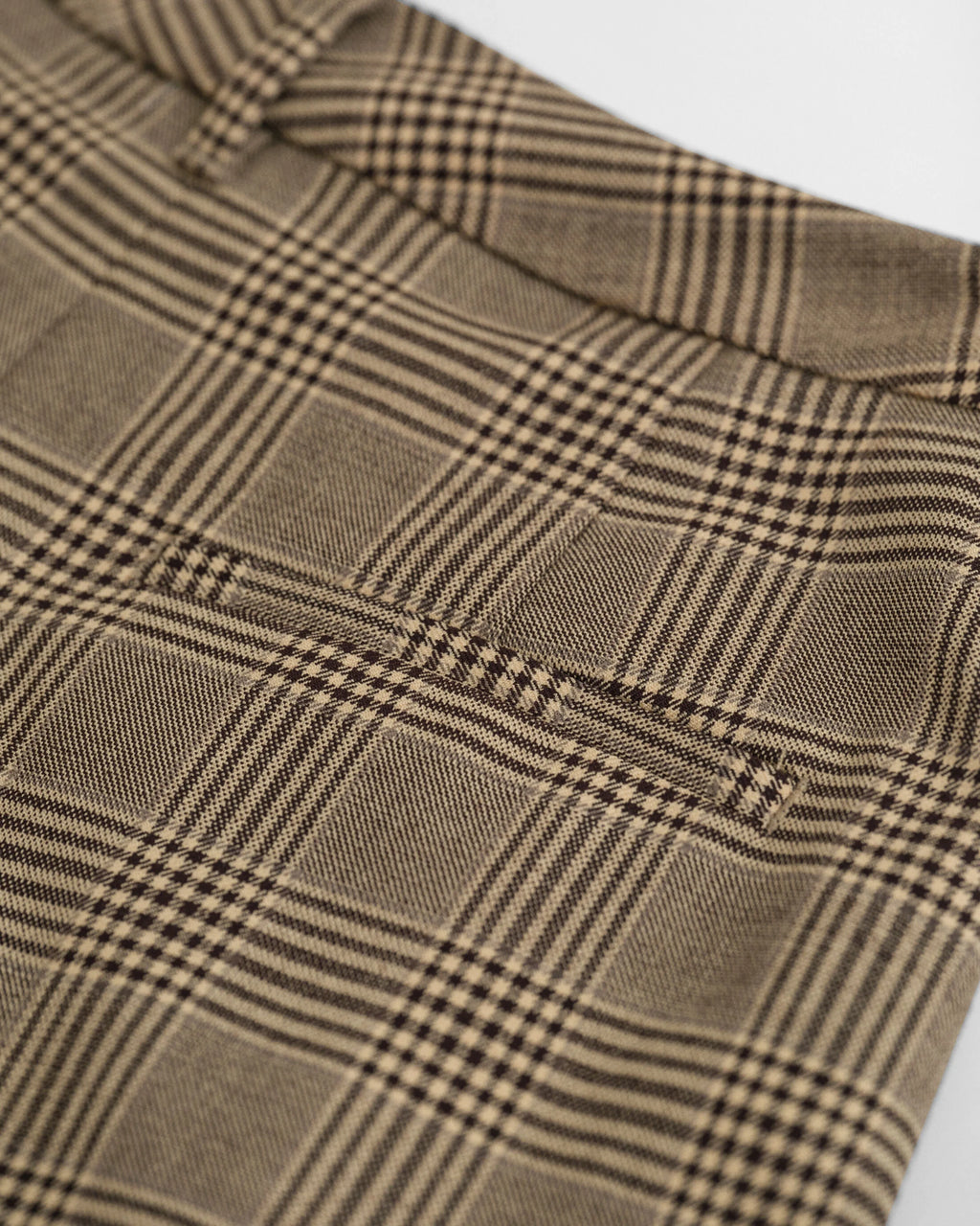 Close-up of a brown and beige checkered fabric texture